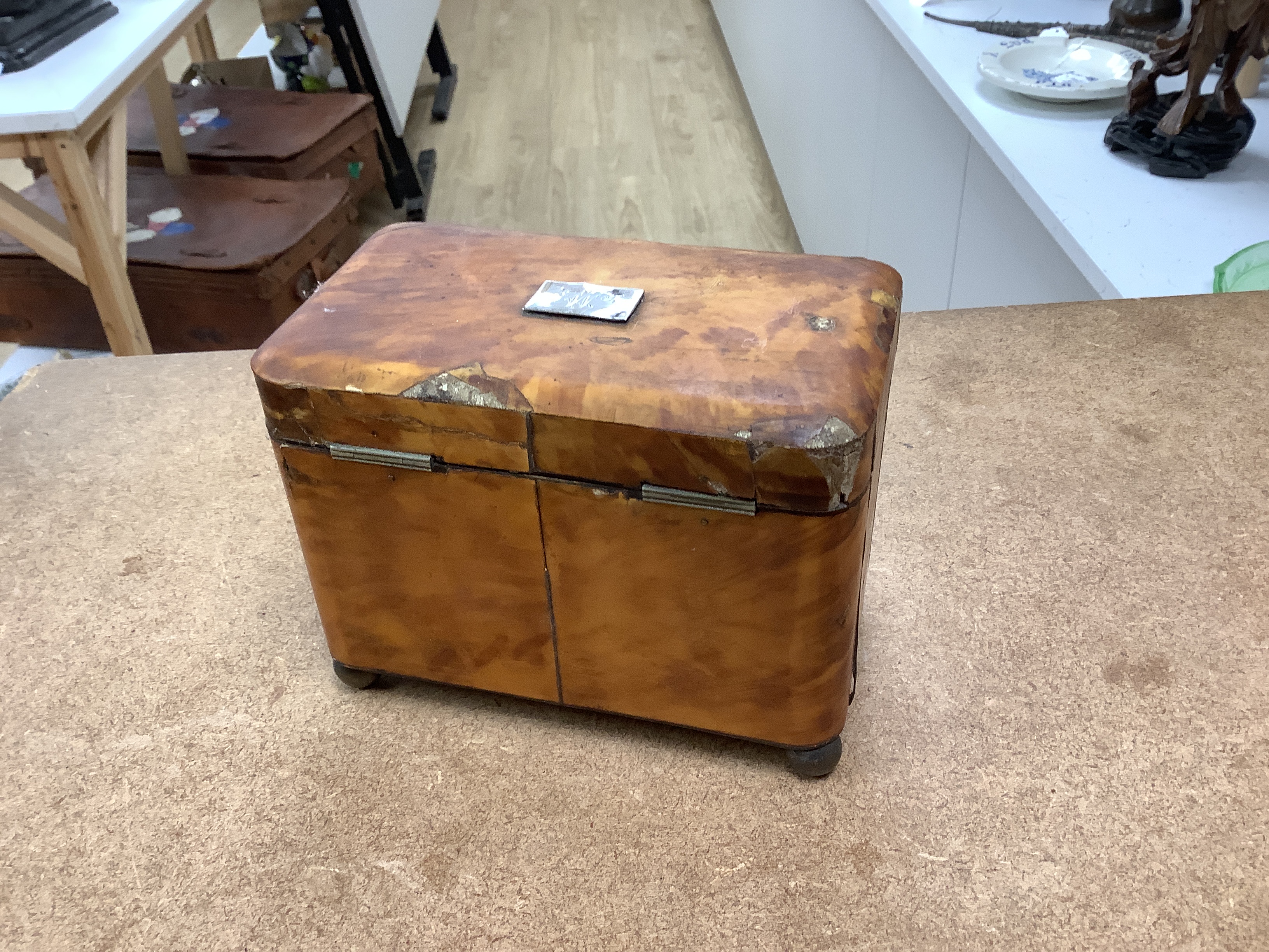 A 19th century two section tortoiseshell tea caddy on ball feet, a tortoiseshell necessaire case and a tortoiseshell and mother of pearl inlaid card case. tea caddy 15cm wide x 11cm high x 9cm deep CITES Submission refer